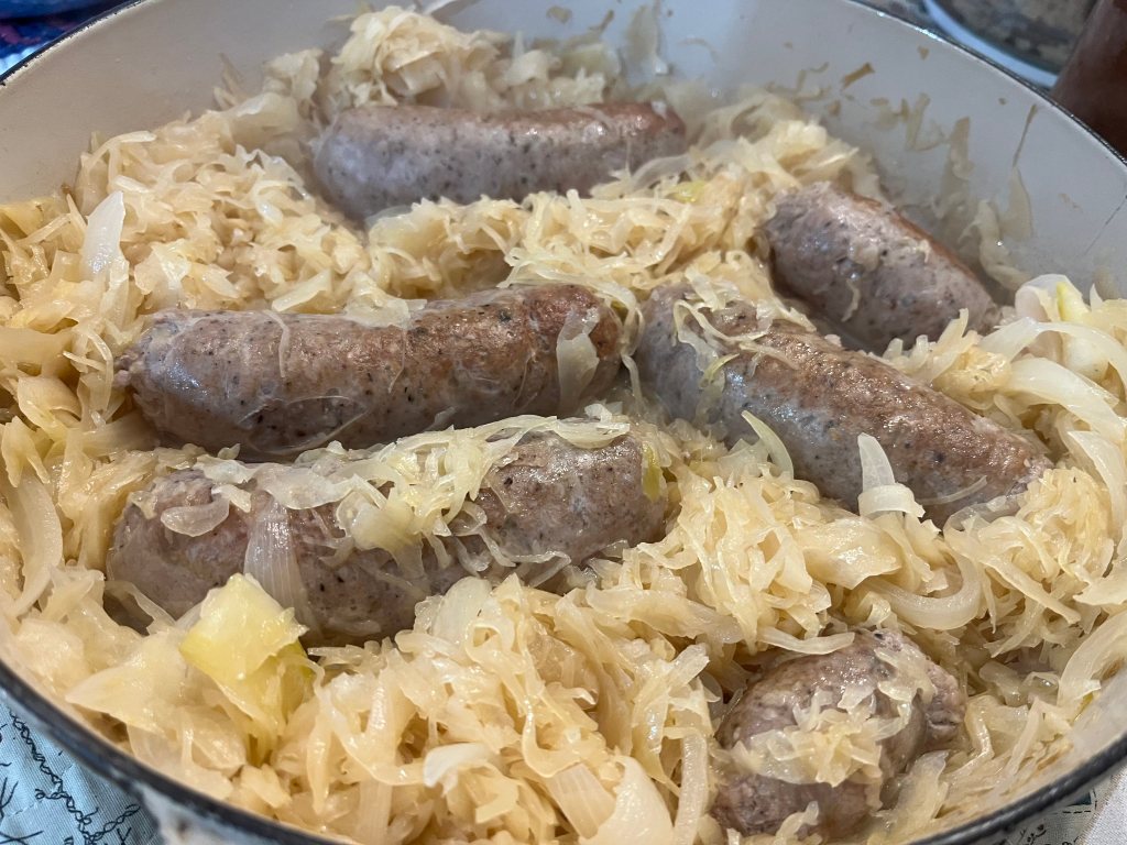 Beer braised cheddar brats and cabbage.