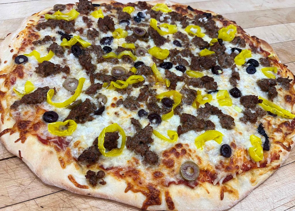 Homemade hand-tossed pizza with BOR Meats Chicago Sausage